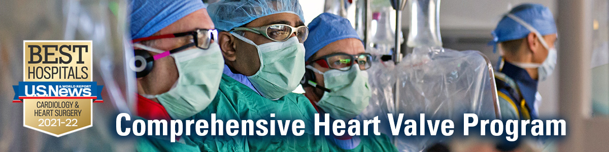 Three surgeons wearing surgical garb. USNWR Best Hospitals badge for Cardiology & Heart Surgery at left of image and text overlay reading "Comprehensive Heart Valve Program" across bottom of image 