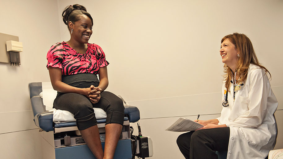 Dr. Melinda Davis examining a patient